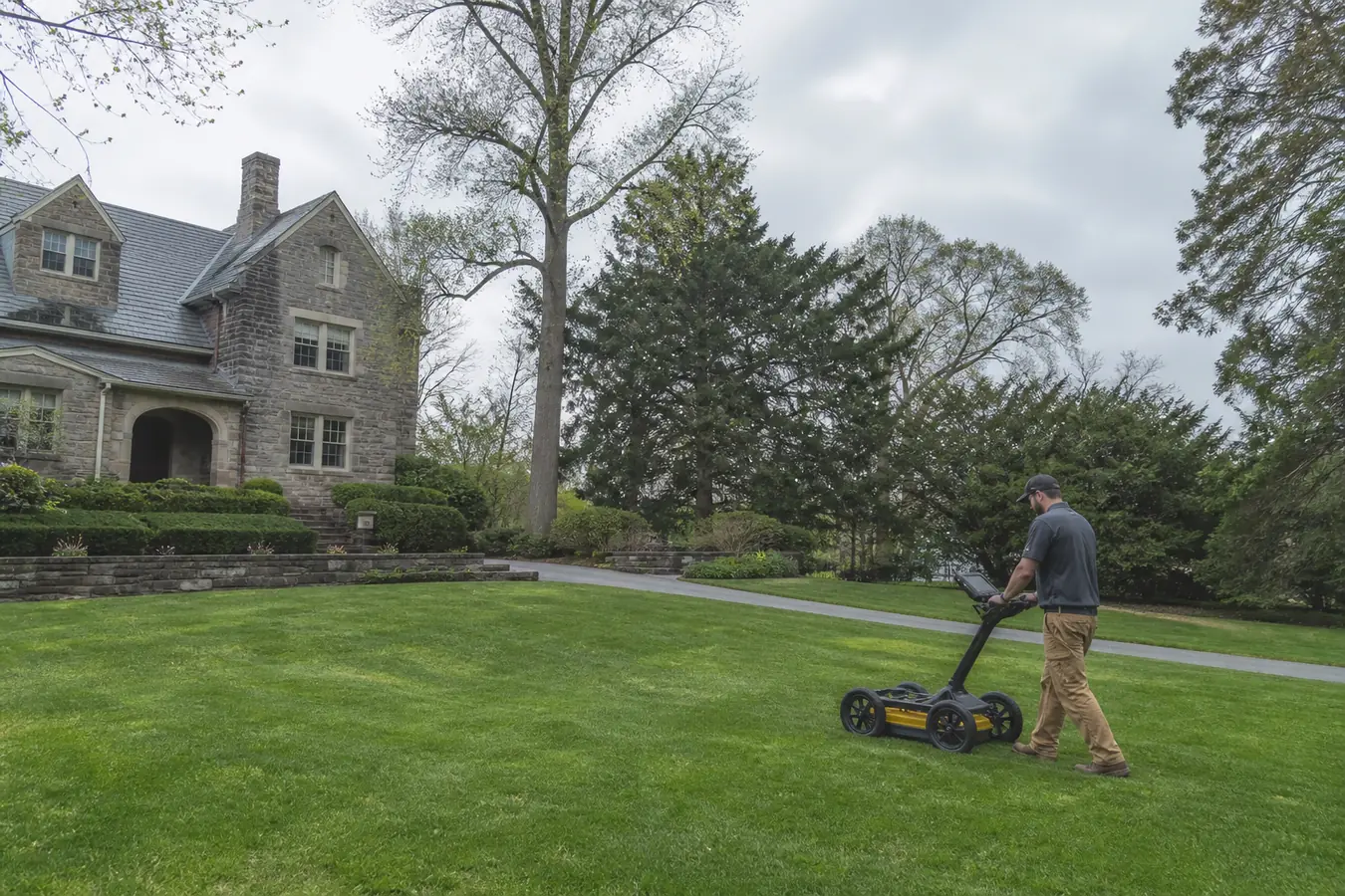 Technician scanning a large Northwest Philadelphia property for an oil tank